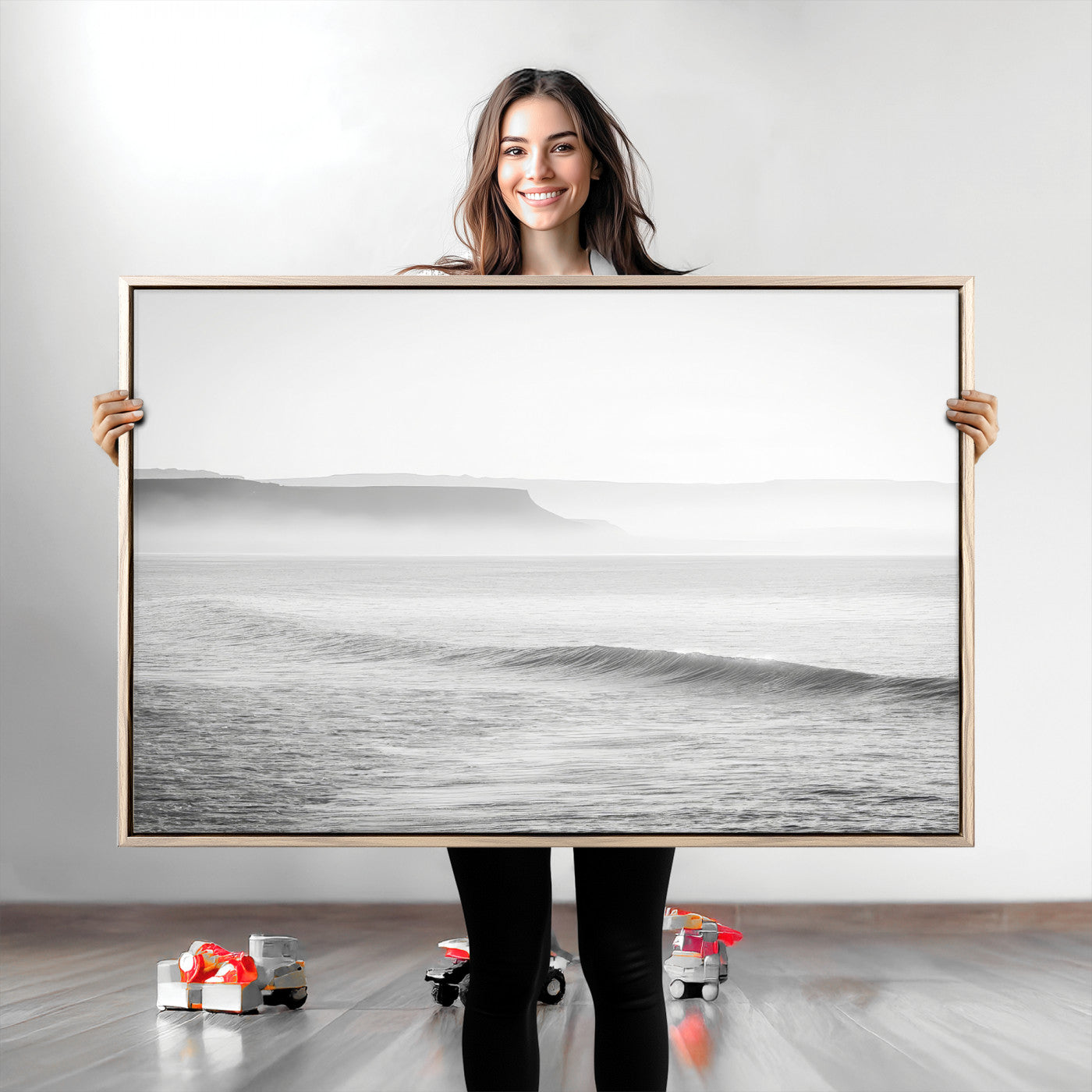 A black and white minimalist seascape featuring soft rolling waves and misty distant cliffs, creating a serene and timeless coastal atmosphere.