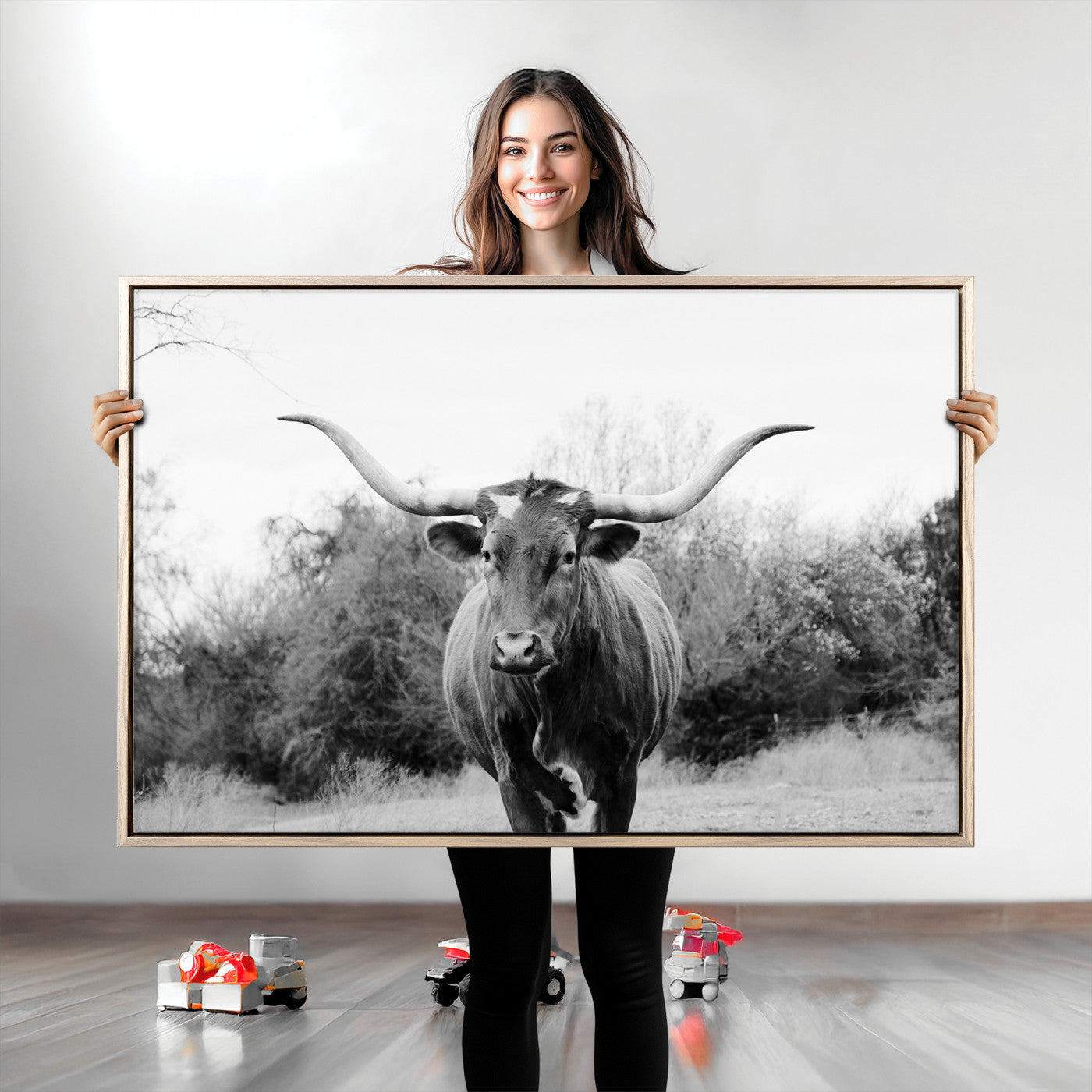 Black and white photo of a Longhorn cow facing camera, ideal for rustic, farmhouse, or western-themed home wall decor.