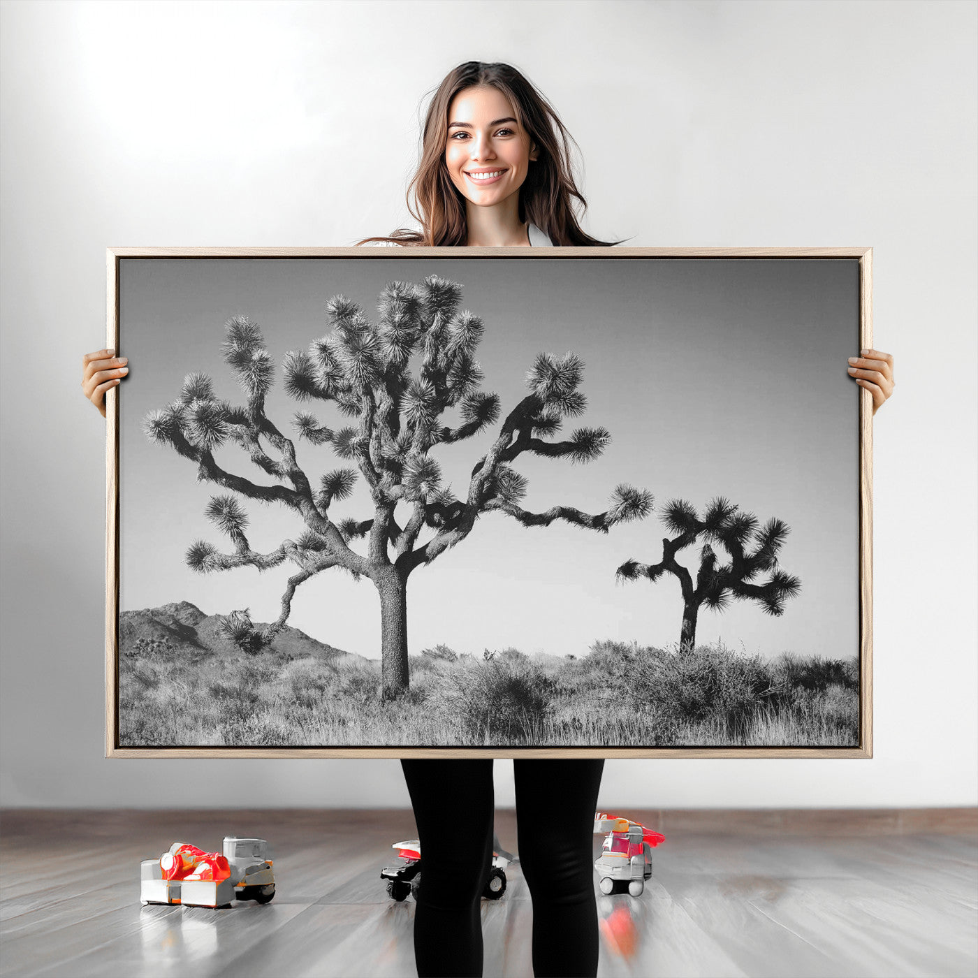 Black and white desert scene with two Joshua trees under clear sky, perfect for rustic or boho-inspired home decor.