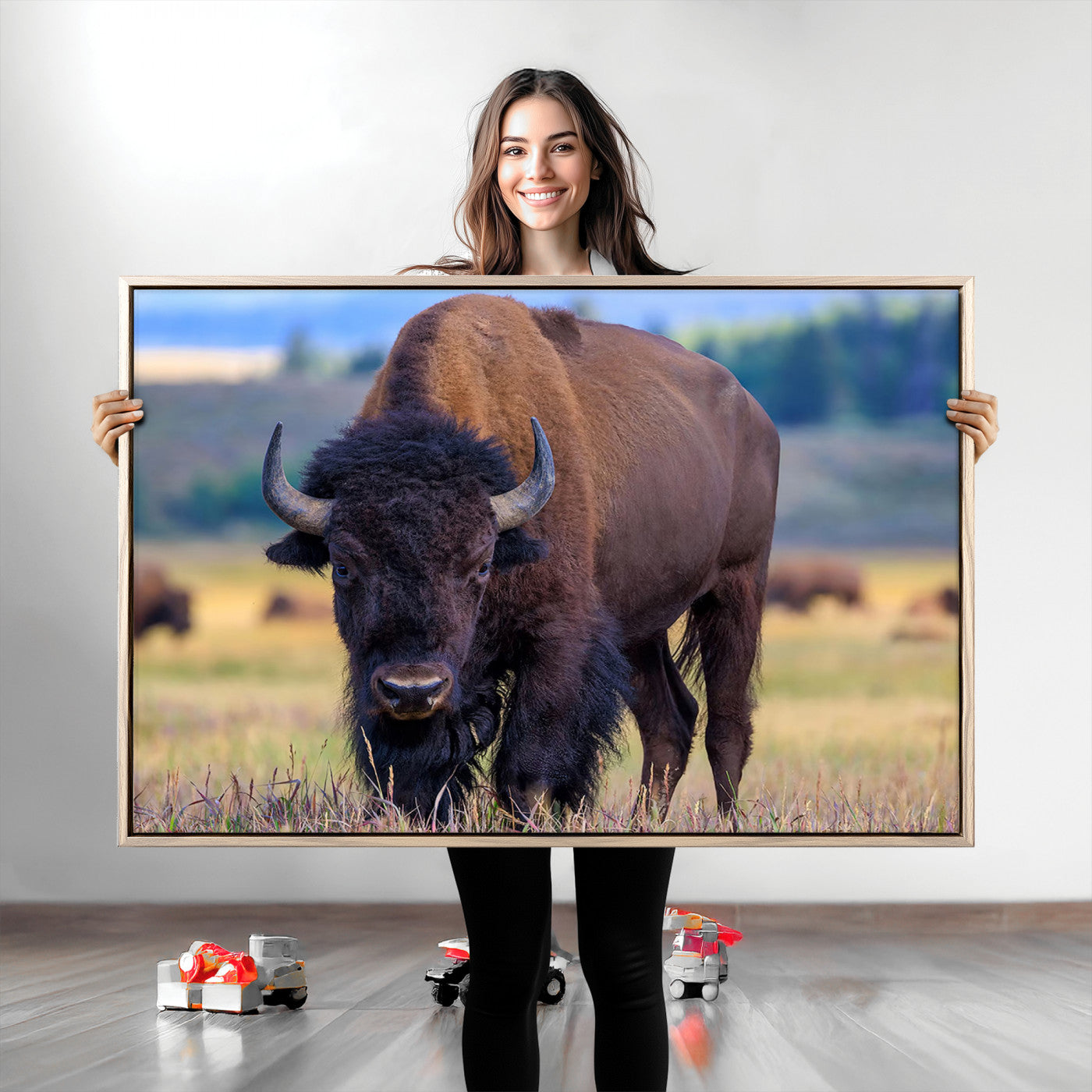 Close-up of a strong American bison standing in a grassy prairie with a blurred herd in background, perfect for rustic lodge decor.