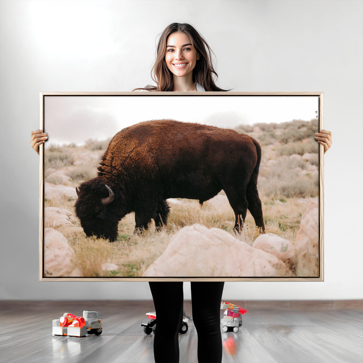 A solitary bison grazing in a rugged prairie with earthy tones and scattered rocks, capturing the essence of the American West for rustic decor.