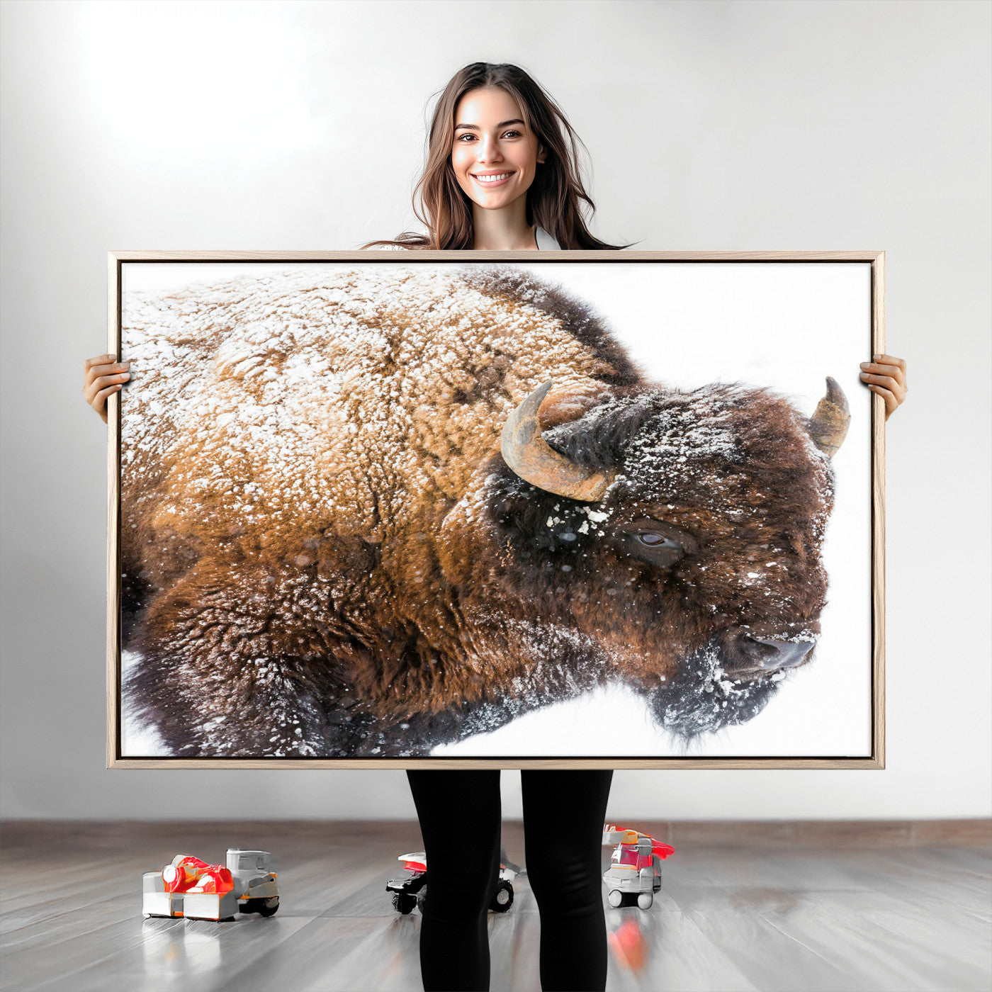 Close-up photograph of a bison covered in snow, highlighting its thick fur and powerful presence, set against a white winter backdrop, ideal for rustic decor.