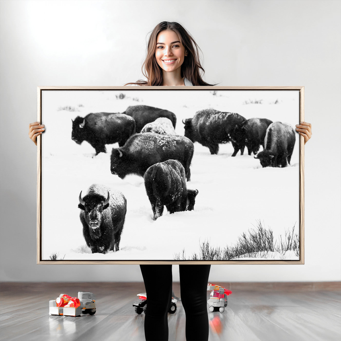 Black and white photograph of a bison herd in a snowy landscape, with snow-covered fur and a rugged wilderness setting, perfect for rustic lodge decor.