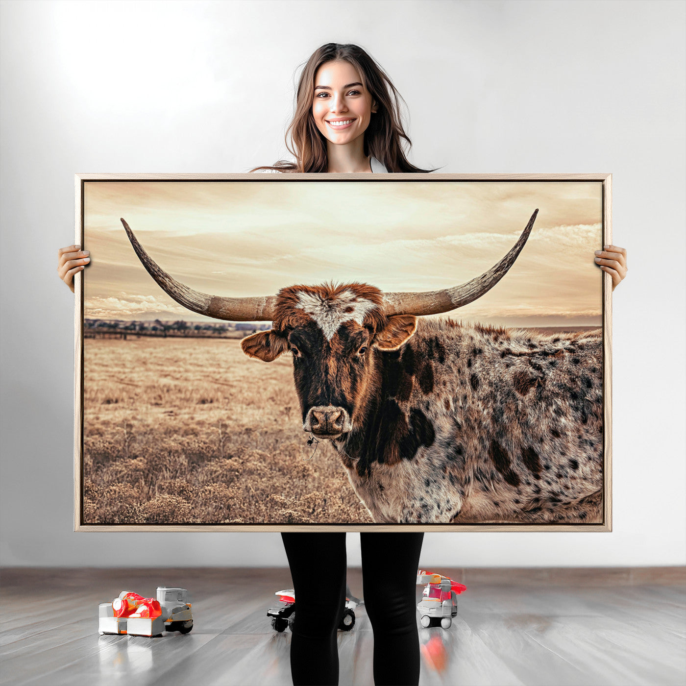 Close-up of a longhorn cow with distinctive curved horns standing in a dry grass field under a cloudy sky.