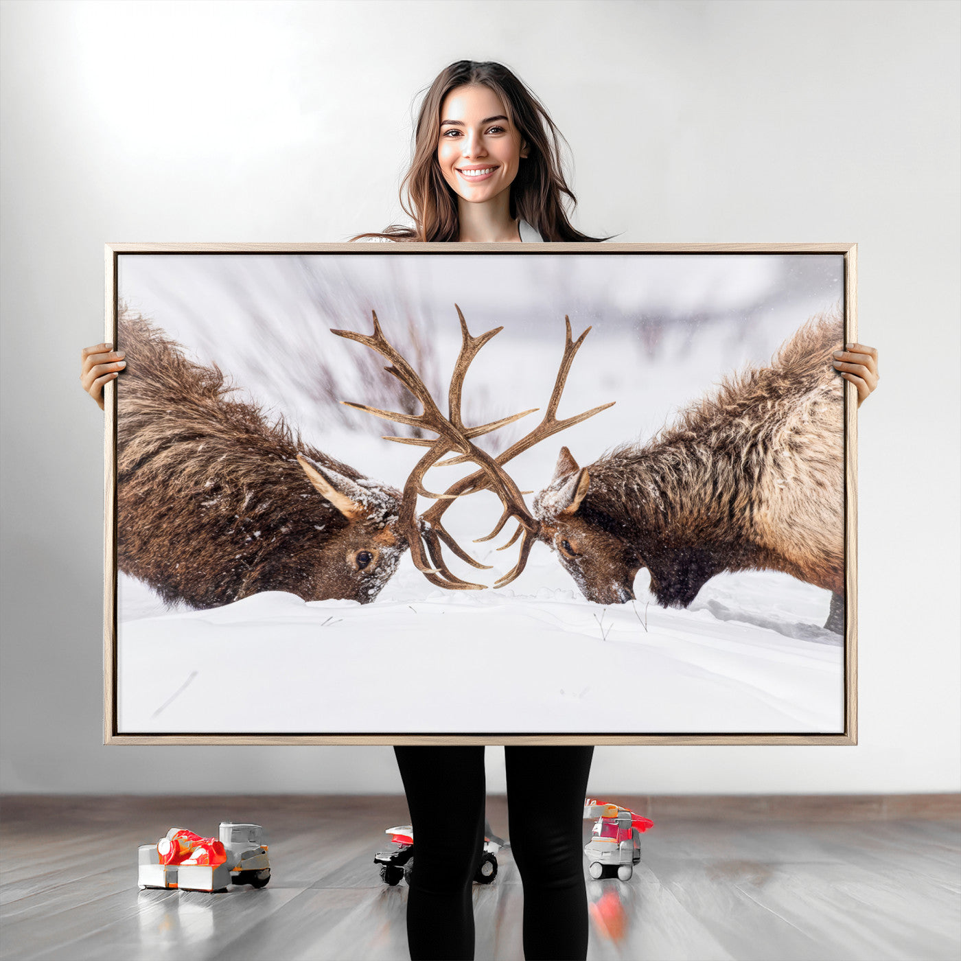 A dramatic wall art canvas print showcasing two majestic elk locking antlers in a snowy winter landscape, capturing the raw power and beauty of wildlife, ideal for nature-inspired home decor.