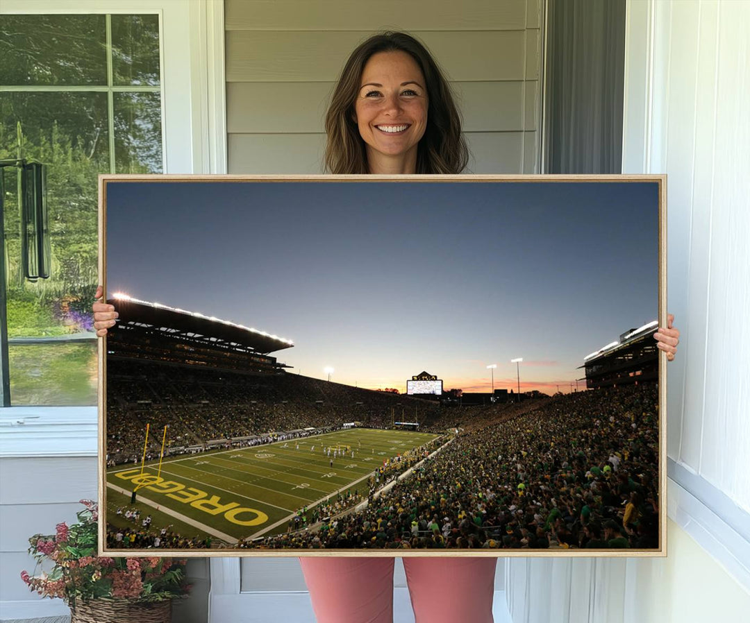 Canvas artwork depicting an Oregon Ducks football game at Autzen Stadium, capturing a sunset and packed stands.