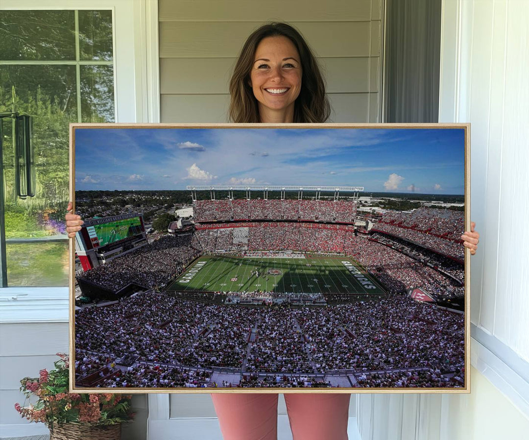 The wall art is a South Carolina Gamecocks print, showcasing Williams-Brice Stadium from a distance under clear skies.