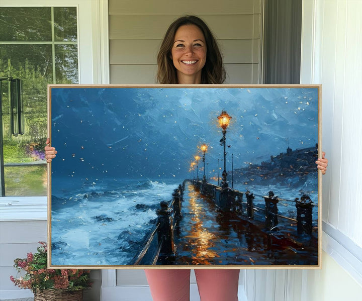 A framed oil painting depicts a stormy night at a beach pier, with glowing lamps and waves beneath a snow-filled sky.