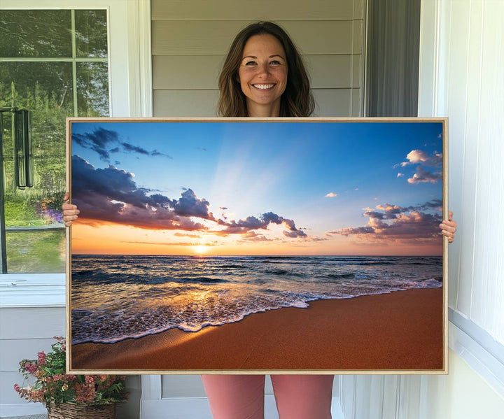 A Golden Hour Beach Sunset canvas hangs in the living room.