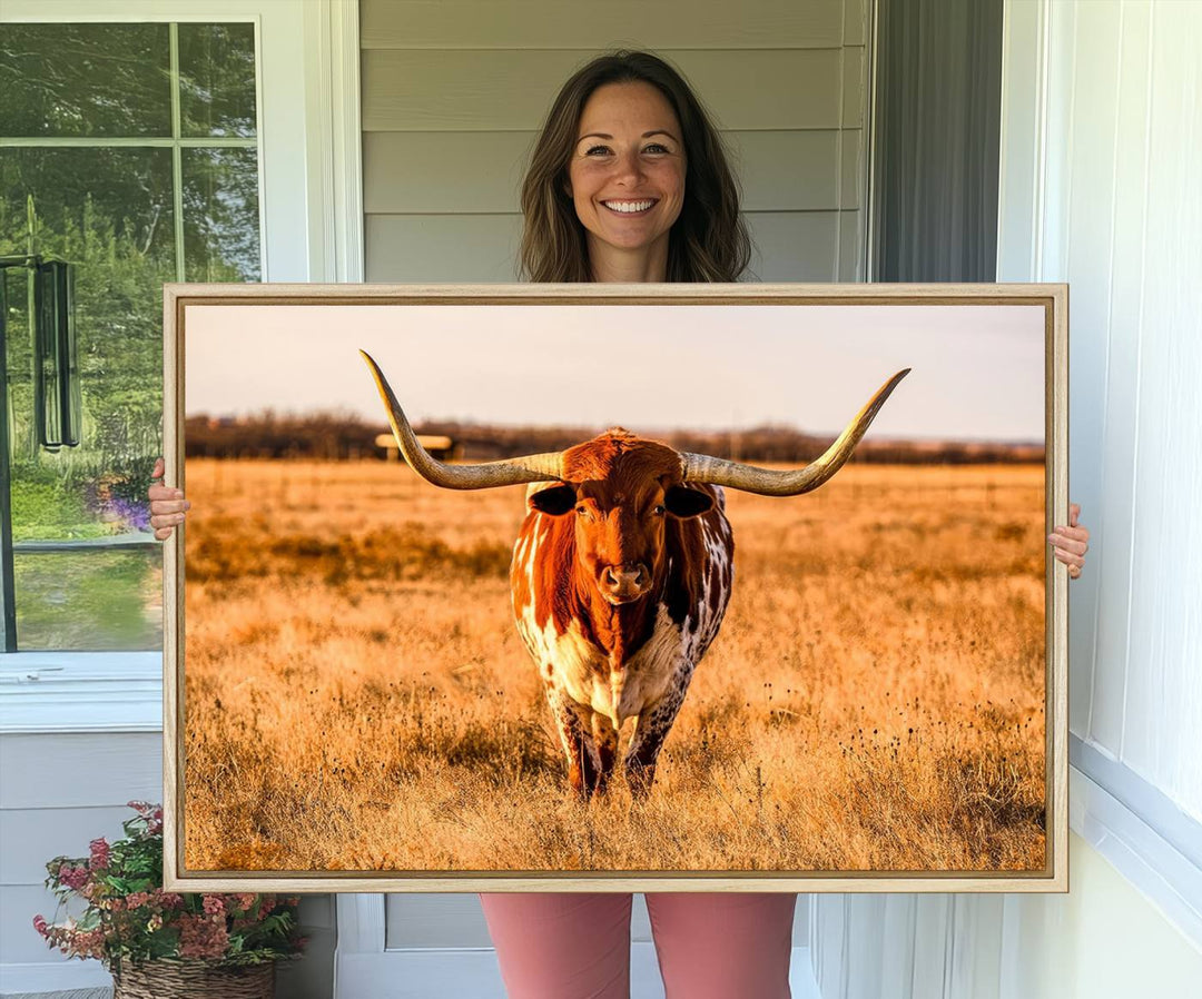 The Longhorn Cow Wall Art framed canvas brings rustic charm and farmhouse decor with its warm field scene.