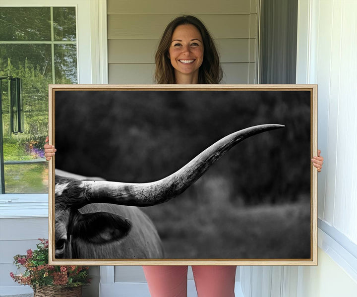 Cow Longhorn Wall Art: This black and white print adds rustic charm.