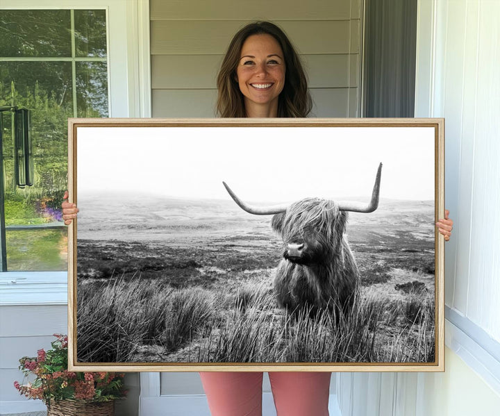 The Scottish Highland Cow black and white canvas print adds rustic farmhouse charm to any wall.