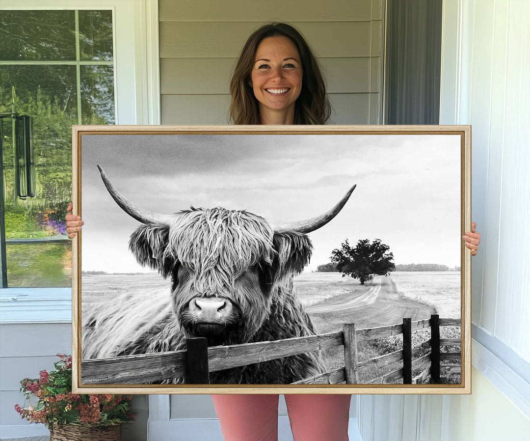 The Scottish Highland Cow Wall Art, a black and white canvas print, enhances rustic farmhouse décor.