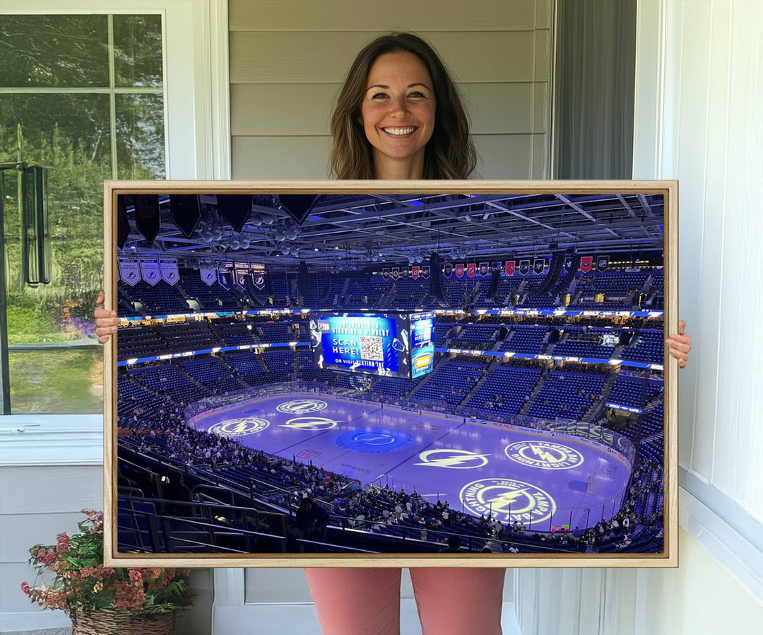 The wall art canvas print at Amalie Arena features team logos on ice, encapsulating the vibrant atmosphere of an NHL hockey stadium.