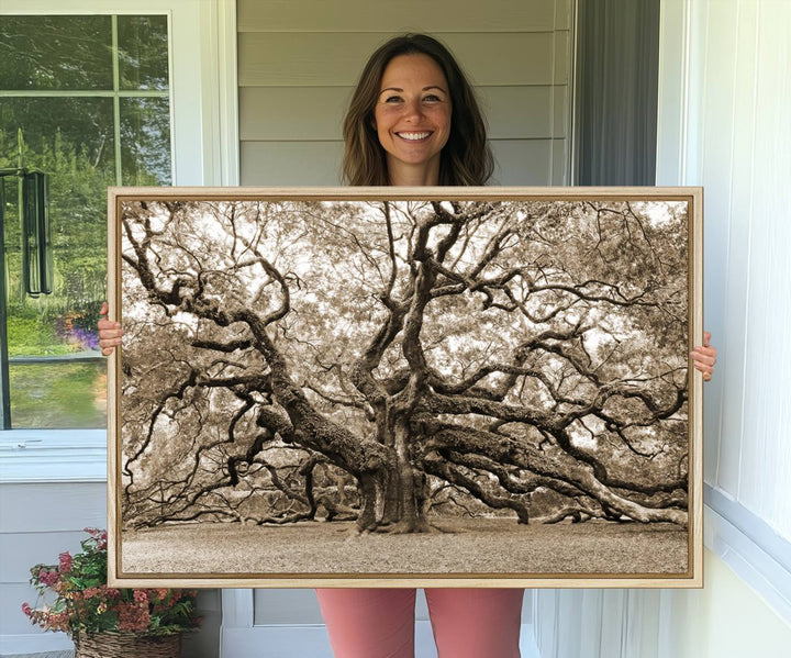 Displayed on the wall is a Sepia-framed Angel Oak Tree 3-panel canvas.