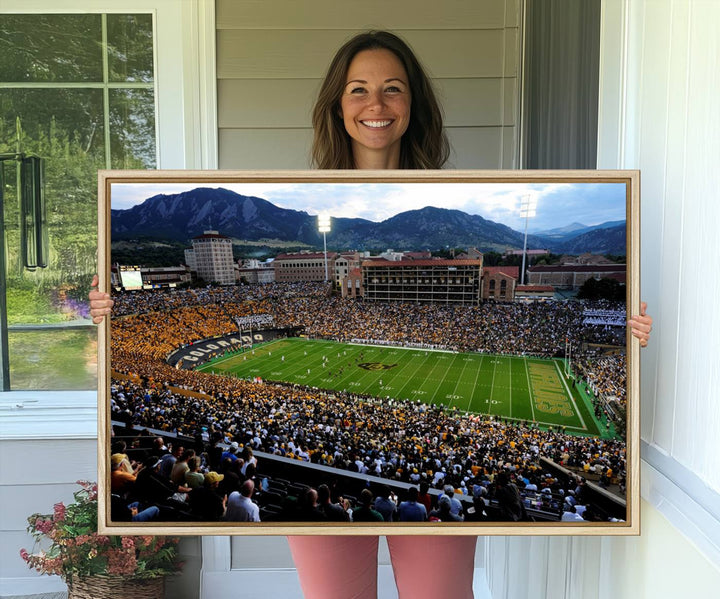 A canvas print captures the Colorado Buffaloes at Folsom Field, framed by mountains in the background.