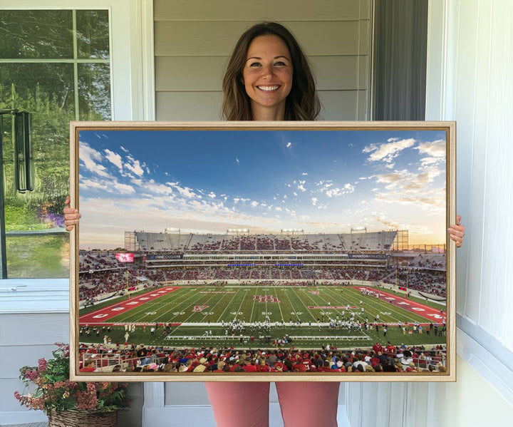 A Houston Cougars print of TDECU Stadium with a game crowd beautifully enhances the living room decor.