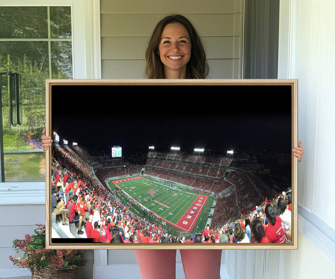 The wall art canvas print features a scene from a packed TDECU Stadium at night, highlighting the field and scoreboard.