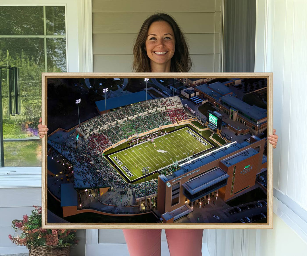 Night aerial view of fans at UNT Mean Green game captured on premium DATCU Stadium canvas wall art print.