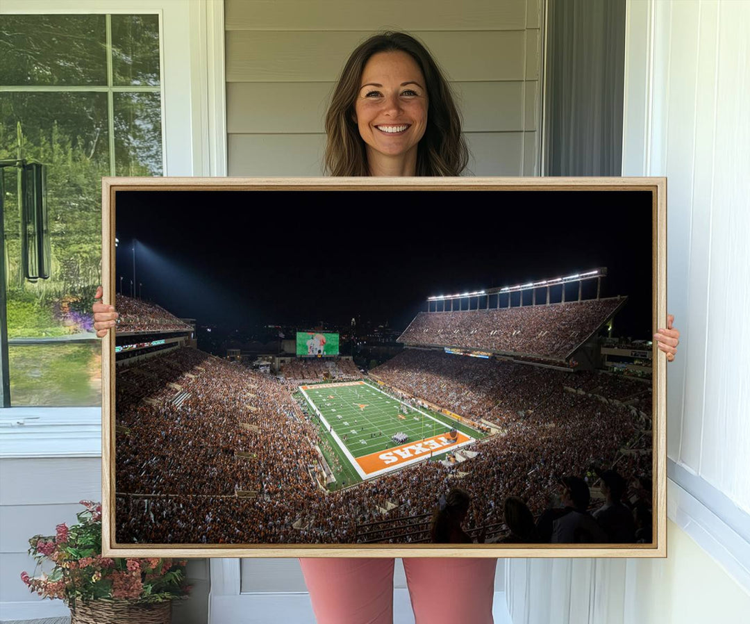 A football game at a packed stadium is captured on the University of Texas Longhorns Stadium Canvas Print.