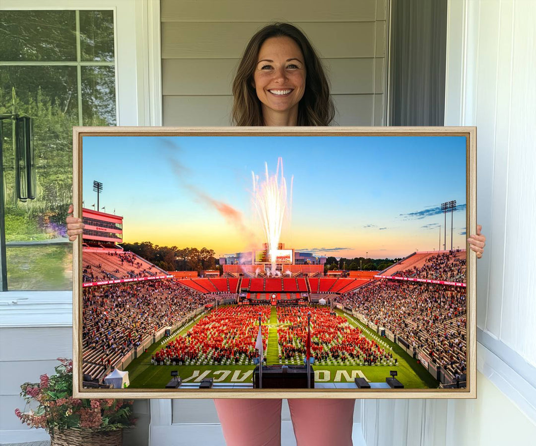 A vibrant North Carolina State University Wolfpack print, capturing a people-filled stadium, fireworks, and a sunset—perfect for your living room wall.