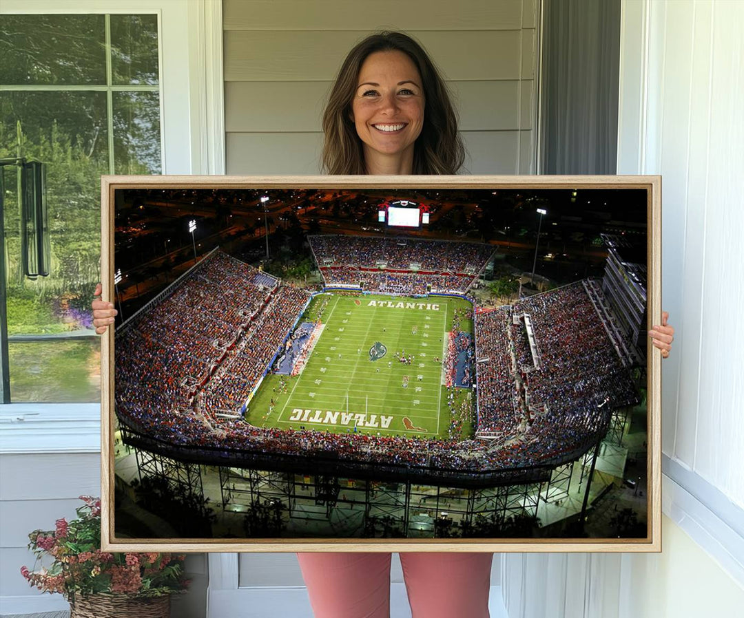 Gallery-quality wall art complements the view of the FAU Stadium with Florida Atlantic University Owls on the field in a night aerial setting.