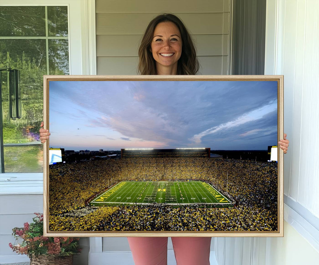 Gallery-quality canvas print of Michigan Stadium at sunset.