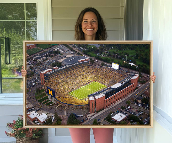 Canvas print featuring an aerial view of Ann Arbor Michigan Stadium filled with Wolverines fans.