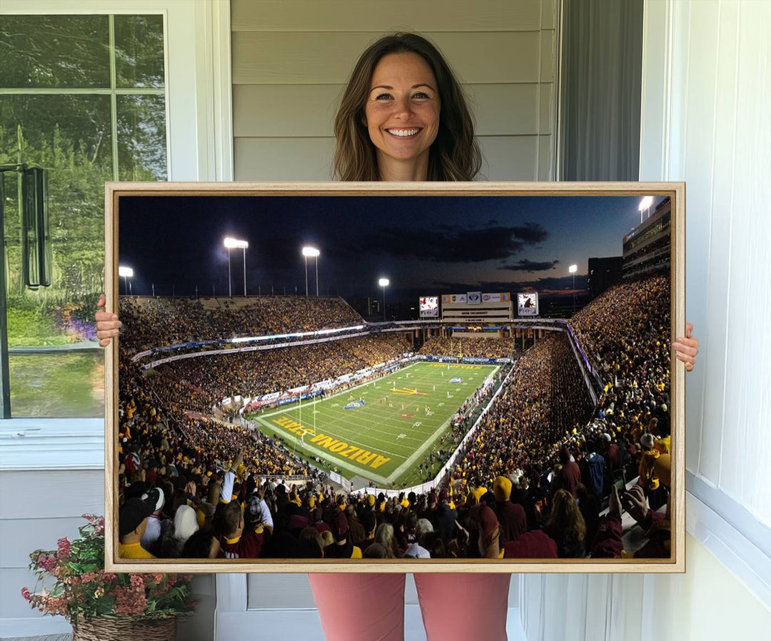 A room featuring an ASU Sun Devils Football Team Print, capturing fans at Phoenix Mountain America Stadium at dusk.