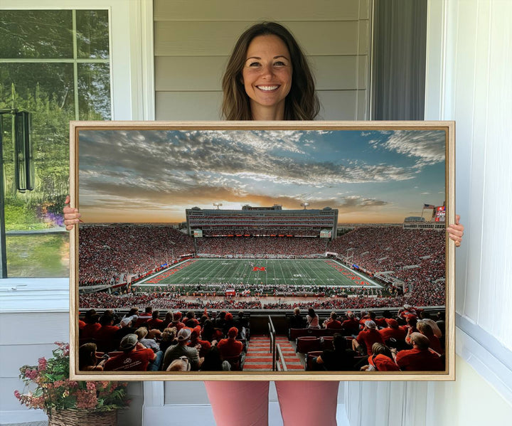 This stunning canvas wall art print features a packed Lincoln Memorial Stadium with the University of Nebraska Cornhuskers at sunset.