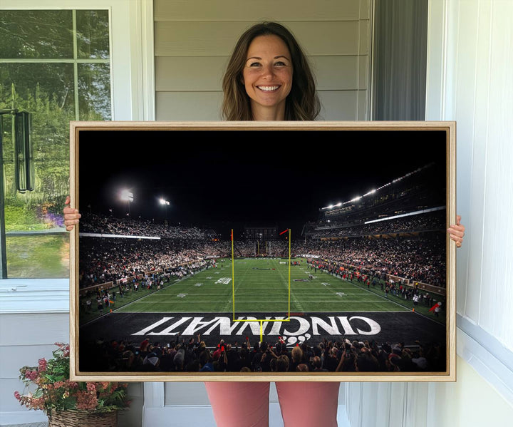 Interior view featuring a Cincinnati Bearcats football canvas of Nippert Stadium.