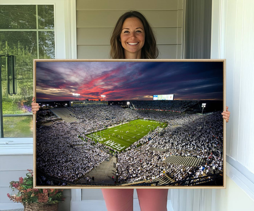 A sunset print on a canvas wall art piece captures the scene of white-clad fans at Beaver Stadium for the Nittany Lions game.