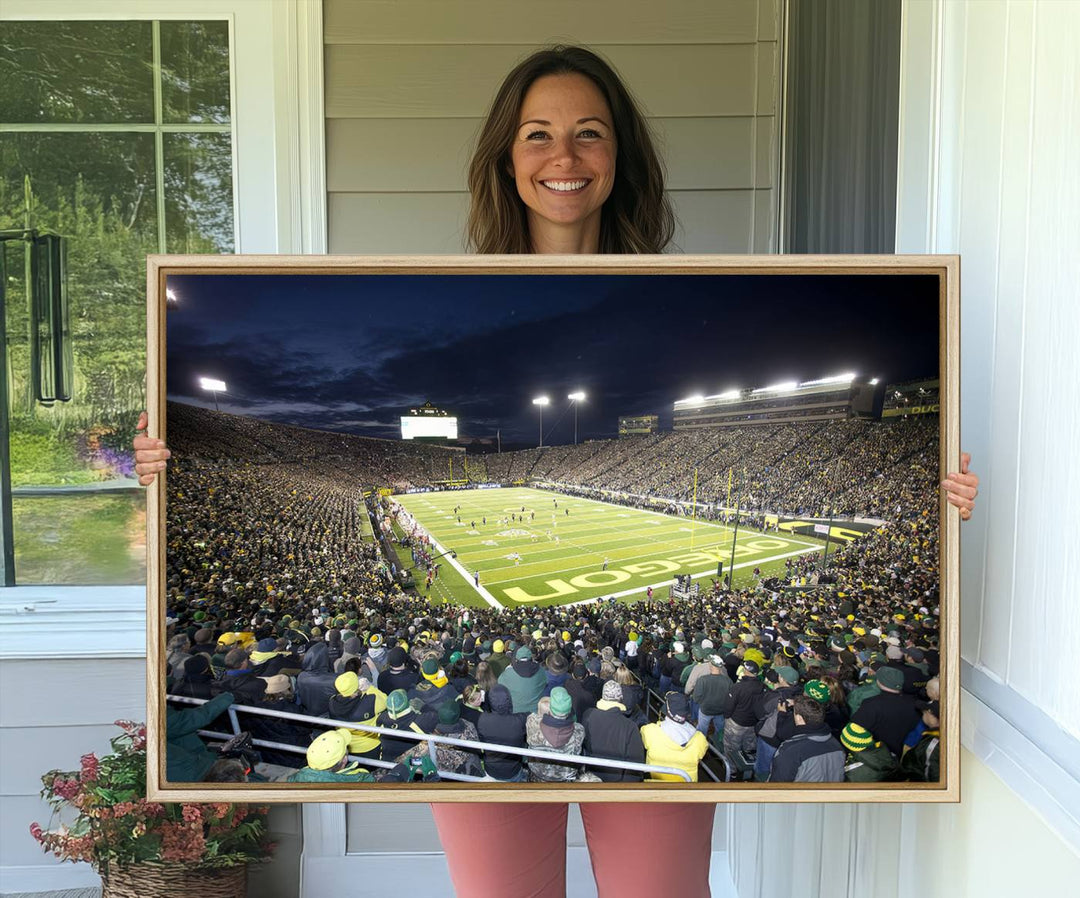 Under bright lights, a University of Oregon Ducks Canvas Print captures the excitement of fans packing Autzen Stadium for a night football game.