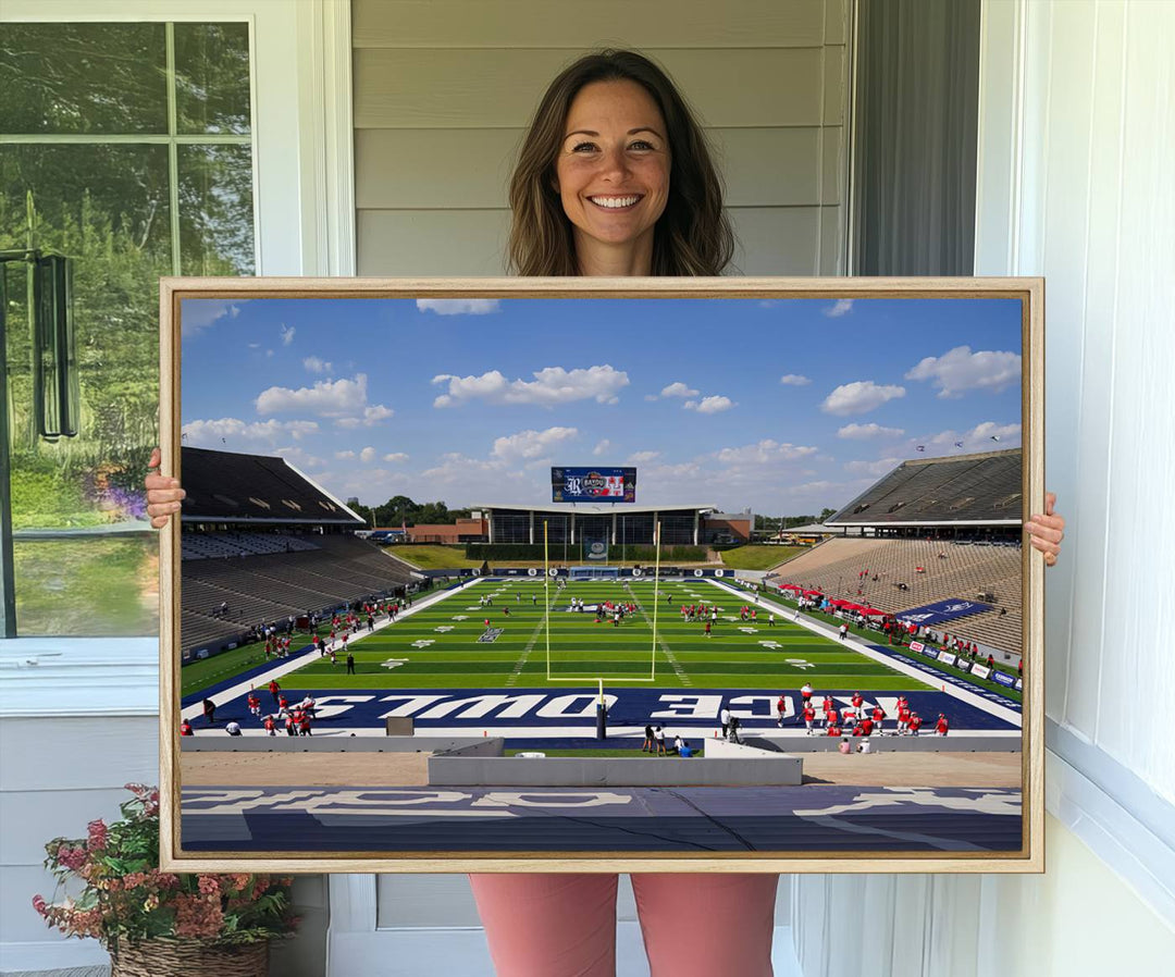 Rice Stadium print: This artwork features a football field with empty stands and a gallery-quality finish under a clear blue sky.