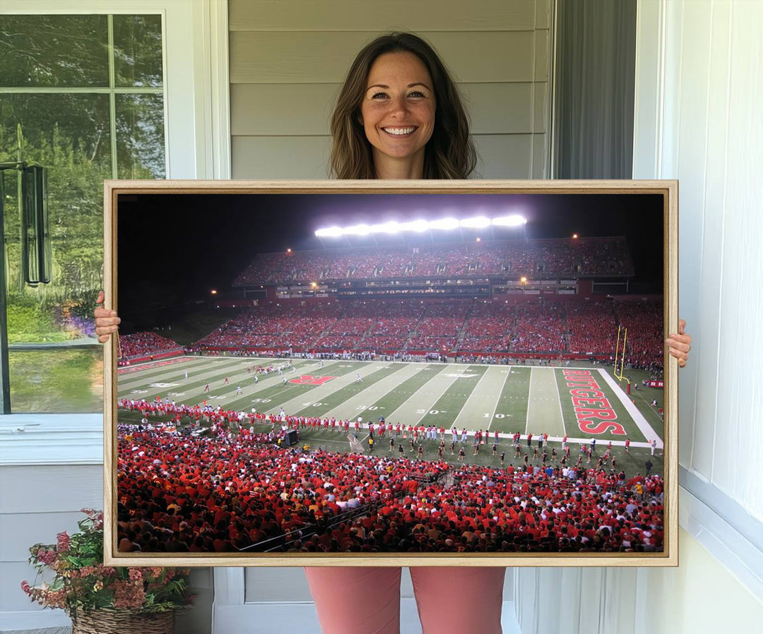 A bustling night game at SHI Stadium is captured as Rutgers Scarlet Knights wall art on a gallery-quality canvas print.