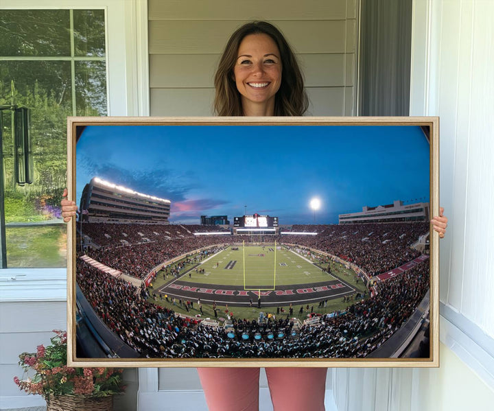 The wall art in the living room features a Texas Tech Red Raiders Football Team Print, showcasing Jones AT&T Stadium at dusk.