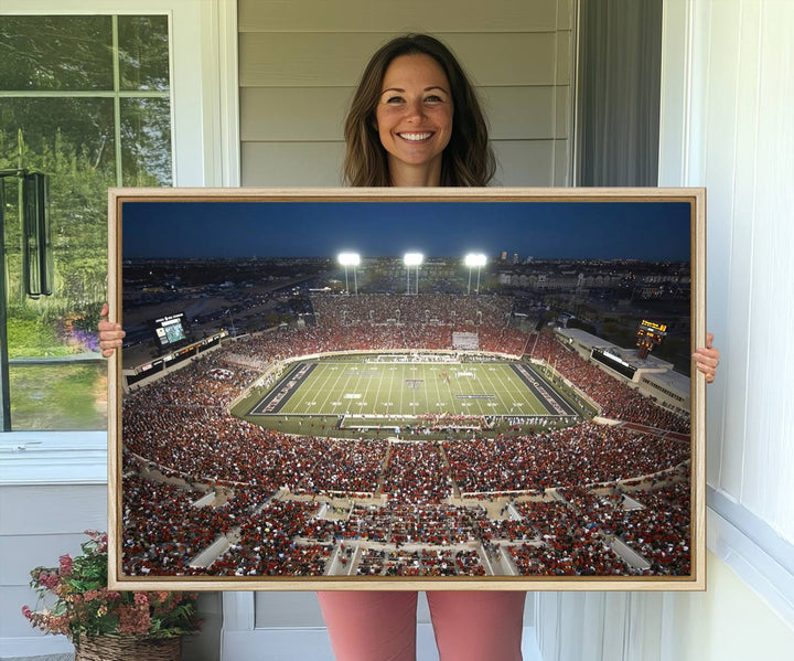 Canvas wall art featuring an aerial view of the Texas Tech Red Raiders packed night game at Lubbock’s Jones AT&T Stadium.