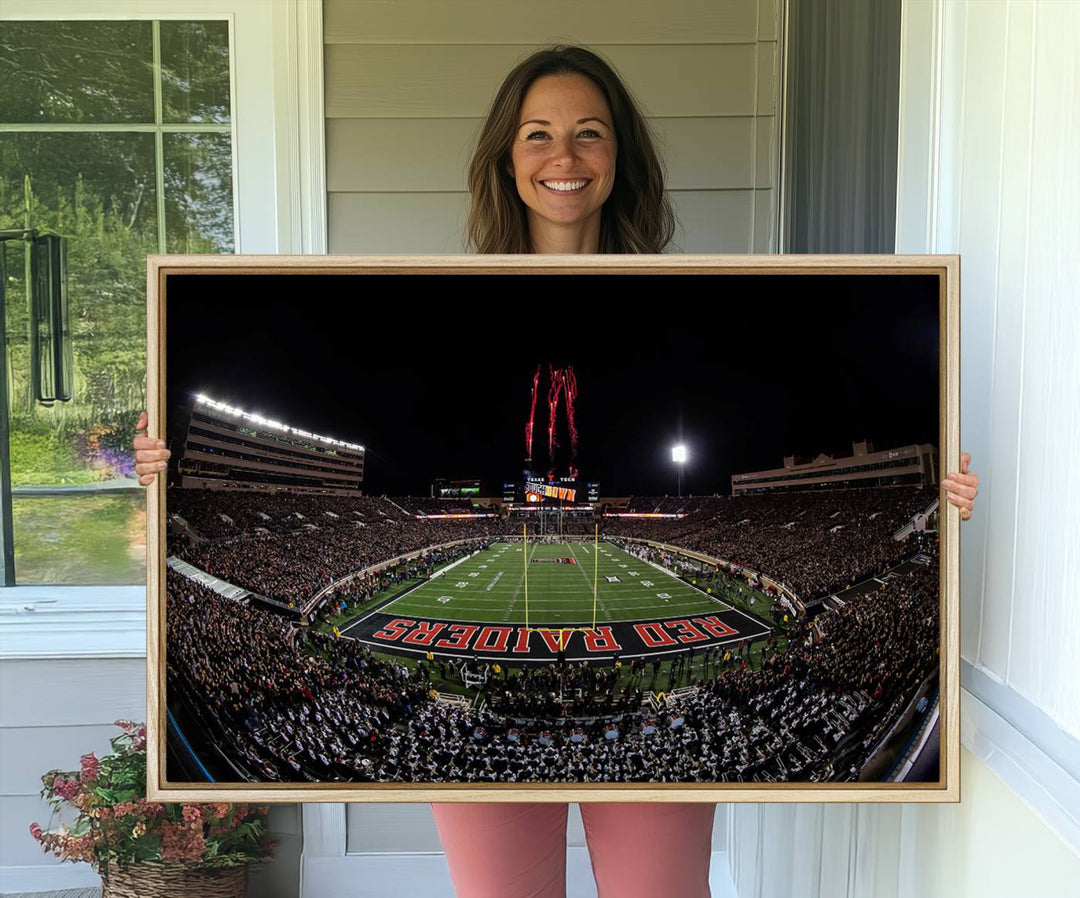 The wall features a Texas Tech Red Raiders Football Team Print on canvas, showcasing fireworks over a packed stadium at night.