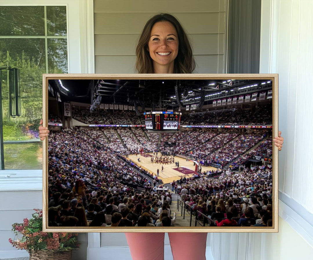 The Nebraska Basketball Arena Wall Art Canvas features an arena filled with Cornhuskers fans and players beneath a scoreboard.