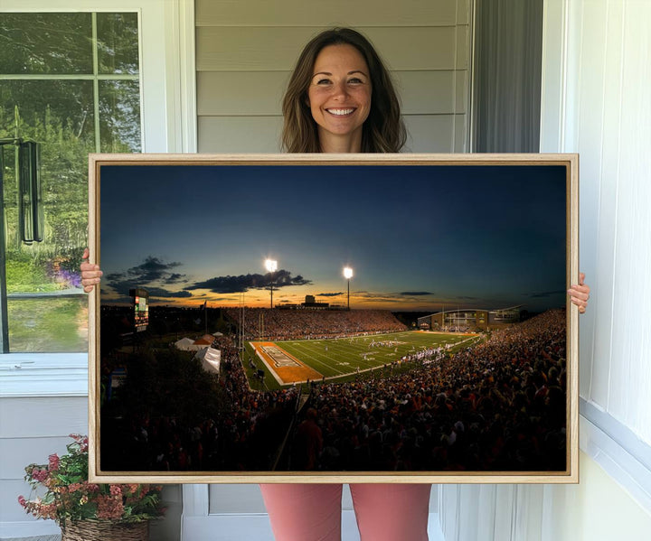 Ball State Cardinals Football Team Print - Muncie Scheumann Stadium Canvas featuring a sunset, floodlights, and lively crowd.