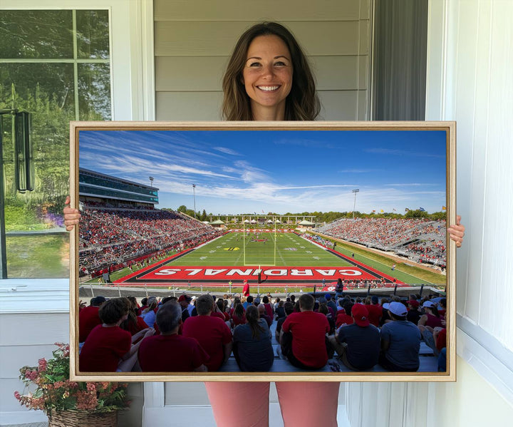 The Ball State Cardinals wall art on canvas depicts fans in red at Scheumann Stadium.