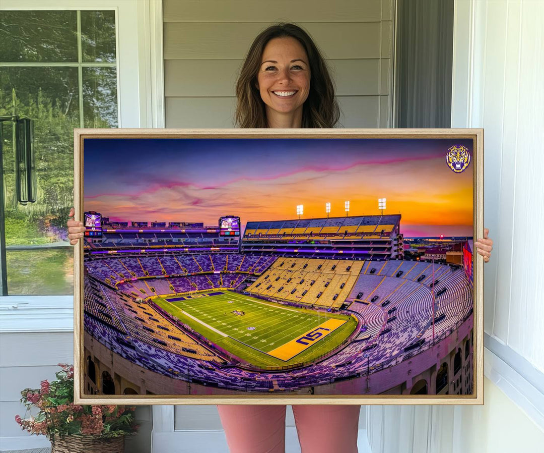 A canvas print of Tiger Stadium at sunset, depicting an empty field and stands, adorns the wall.