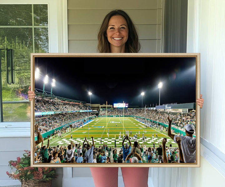 This vibrant wall art canvas print captures the excitement of fans cheering for the Tulane Green Wave Football Team under the lights of Yulman Stadium.