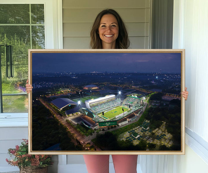 The USF Bulls Football Team Wall Art Canvas Print showcases the Tampa USF Football Stadium at night with city lights.