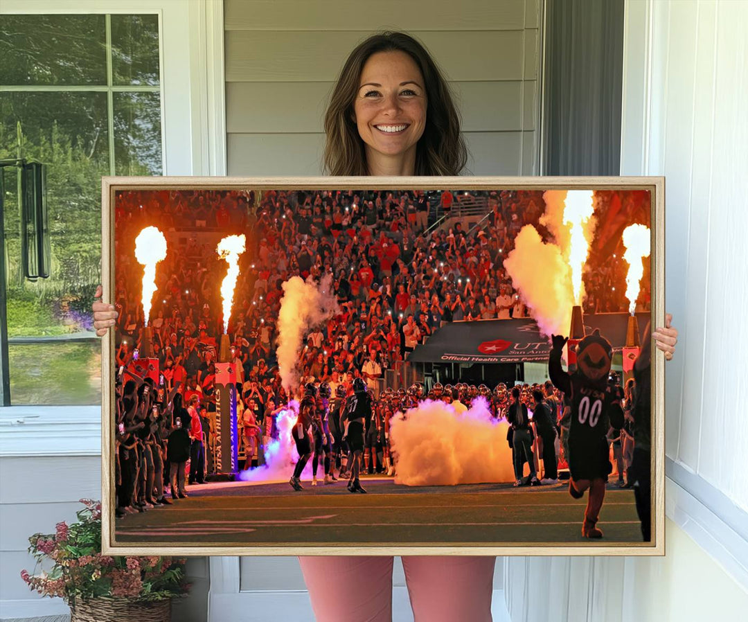 This canvas print captures the UTSA Roadrunners storming the Alamodome under smoke and fire.