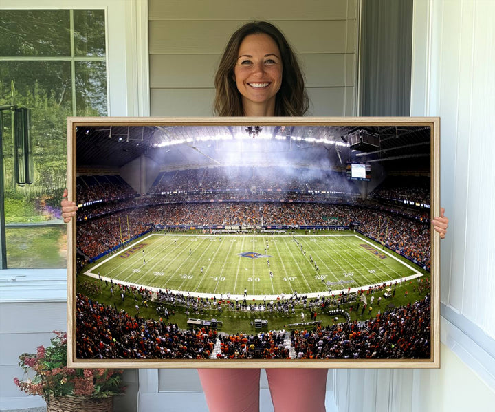 The modern living room features an Alamodome wall art canvas print, depicting a stadium filled with spectators for a UTSA Roadrunners game.