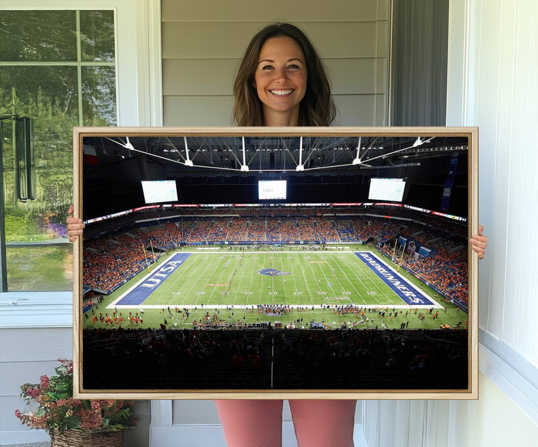 The UTSA Roadrunners game at Alamodome canvas print captures the scene from above, displaying fans and the UTSA lettering on the field.