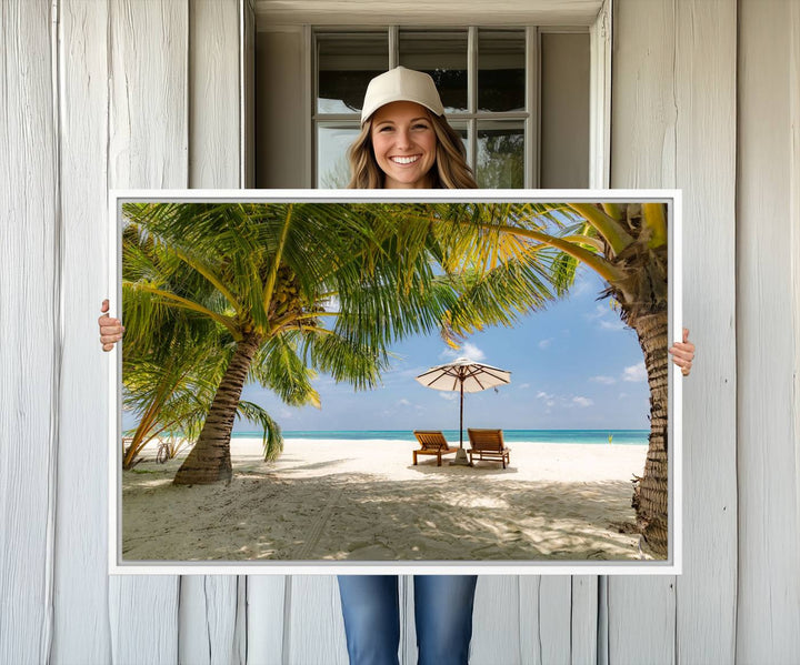 The canvas art print titled Lounge Chairs Palm Trees on Tropical Beach offers free shipping.