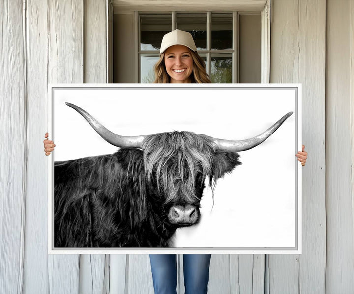 The Black and White Highland Cow Multi Panel Wall Art Canvas Print with UV-protection hangs prominently.