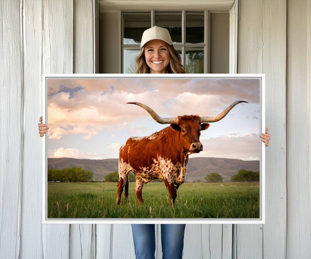 The Texas Cow Canvas Wall Art print captures a longhorn cow at sunset and is ready to hang.